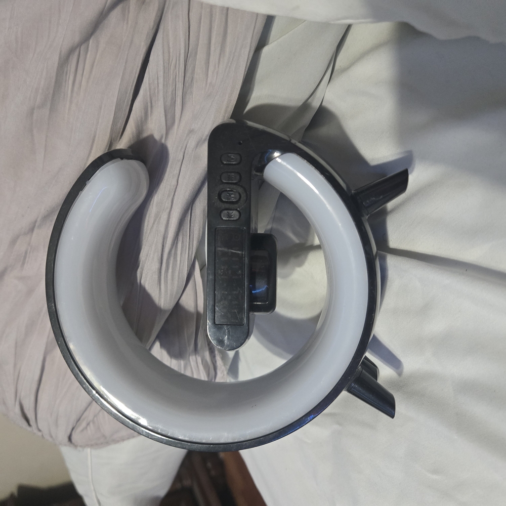 Black and White speaker and wireless phone charger